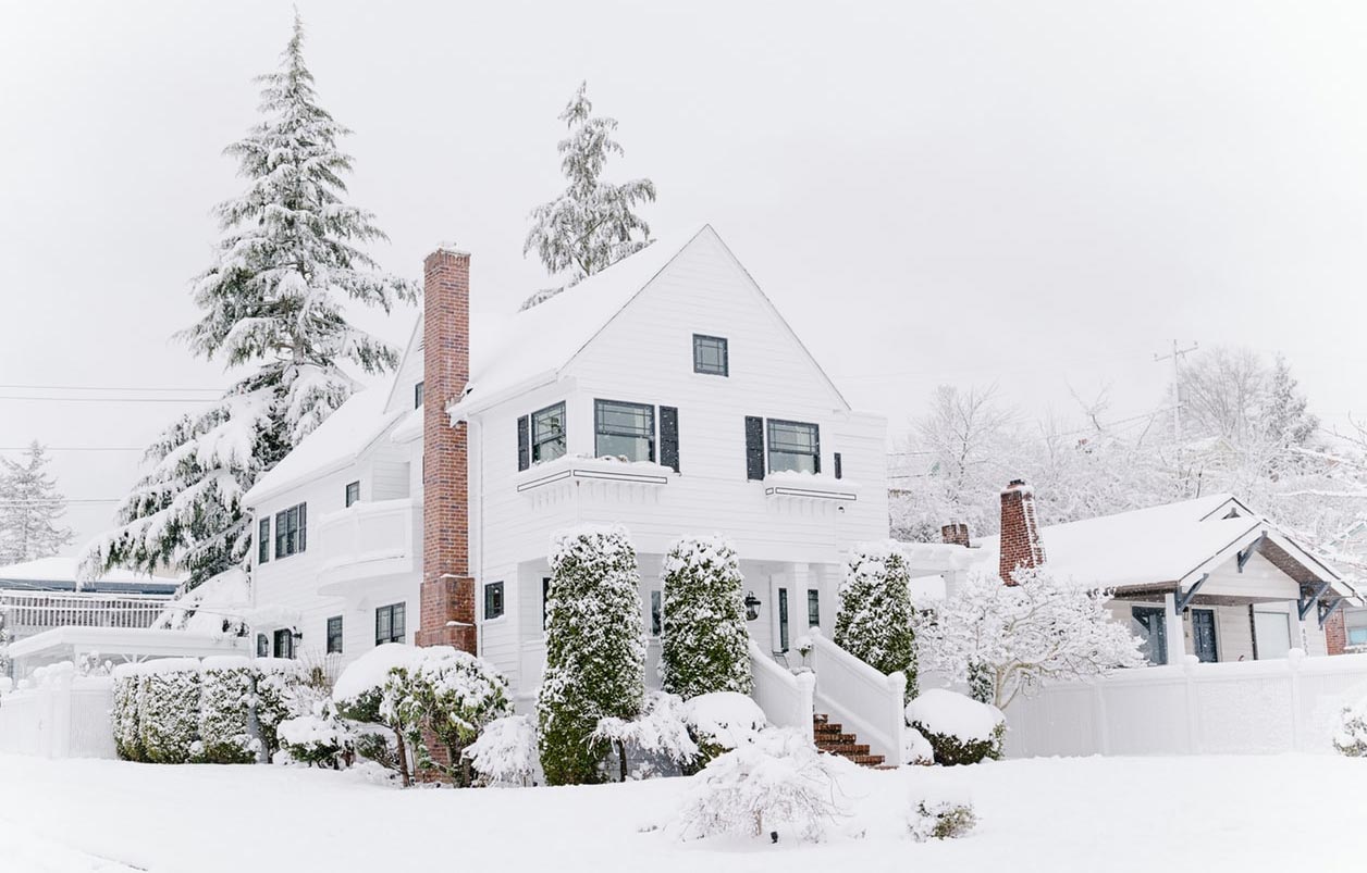 Farmhouse Covered in Snow